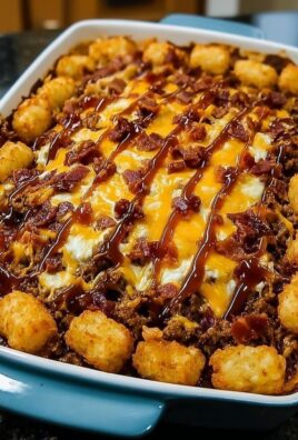 Bacon and cheese loaded tater tot casserole drizzled with barbecue sauce