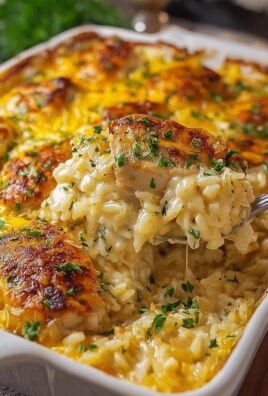 Creamy chicken and rice casserole topped with golden melted cheese and fresh parsley.